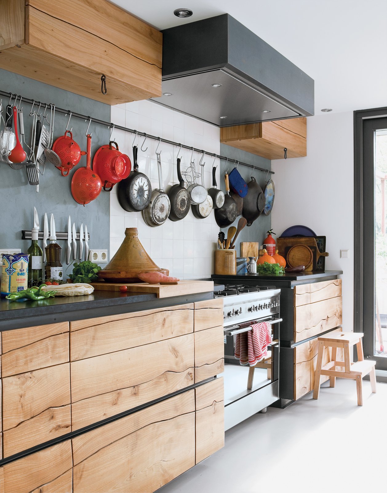 The original stain of wood cabinets can fade, yellow, or discolor over time, and varnish can also change in color and texture. A good sanding and new stain, oil, or other treatment can give old wood cabinets a new life—but it takes some work!