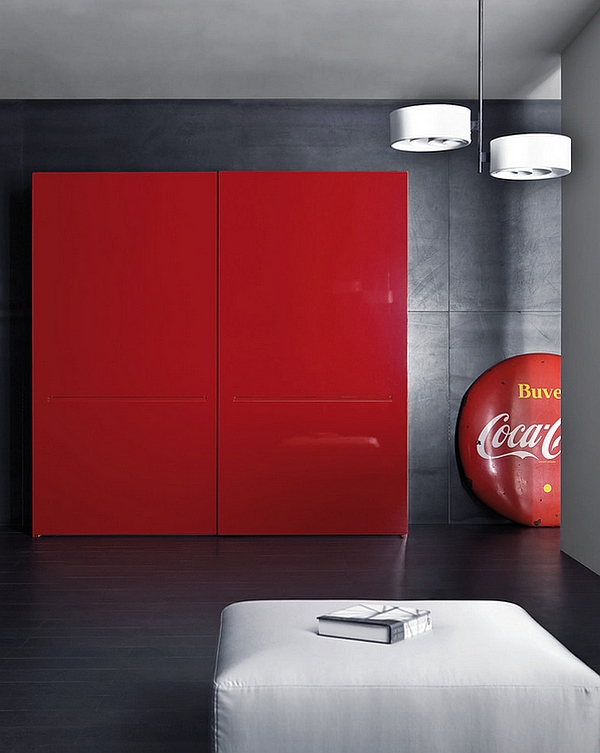 Custom made shelf in classic Coca-Cola red along with round coke logo in a minimal space