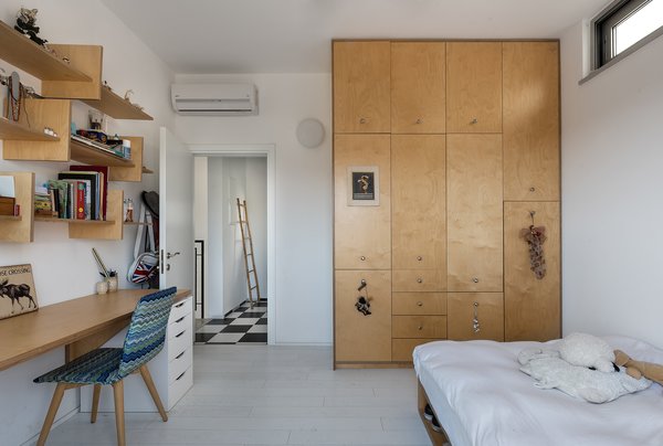Neuman Hayner designed The House by the Dunes for a family of five who all enjoy surfing the beaches of Israel. The architects took a minimalist approach to designing each room, keeping colors and materials simple yet functional.