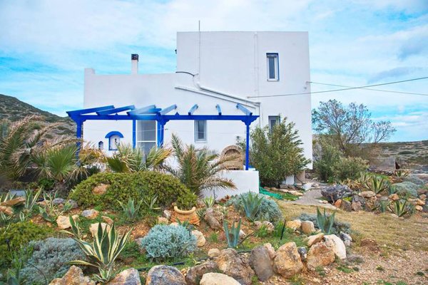 The mediterranean island is home to an array of succulents and chaparral. The white and blue buildings are a signature of the region. 