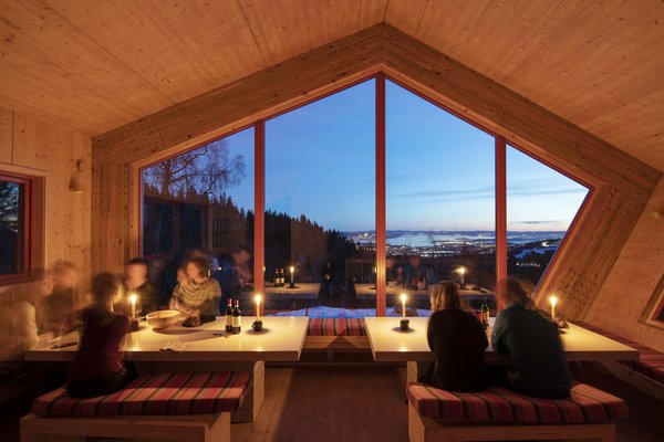 A panoramic, south-facing window offers spectacular views of Oslo.