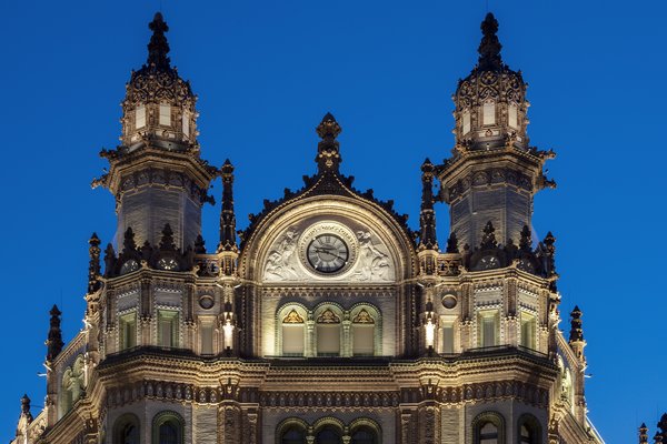 Paris Court in Budapest, also known as the Brudern House, is eclectic in style, combining Art Nouveau, Moorish Revival, and Gothic forms and motifs for a highly decorative exterior and interior.