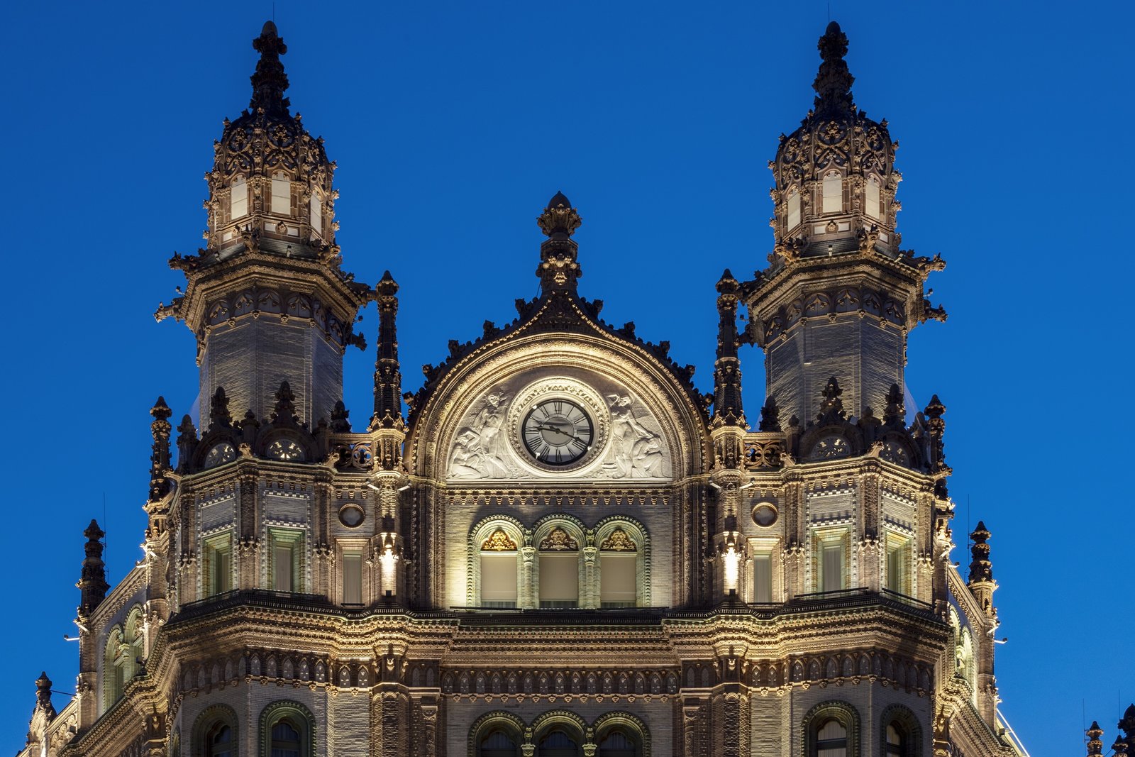 Paris Court in Budapest, also known as the Brudern House, is eclectic in style, combining Art Nouveau, Moorish Revival, and Gothic forms and motifs for a highly decorative exterior and interior.