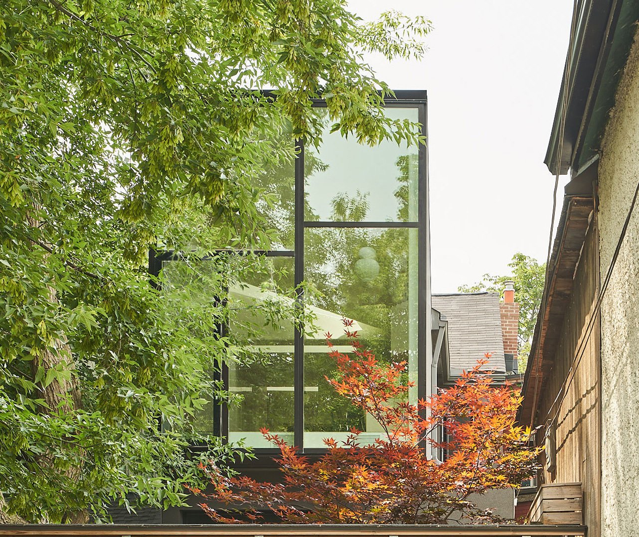 Capping off the second floor is a 14-foot-tall glazed window wall, a dramatic scale change from the original Victorian interior.