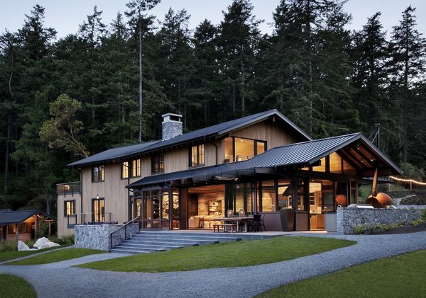 "The choice of materials was made to fit the palette of the landscape and evoke the traditional farmhouses and cabins of the islands, but with a modern take that fits the freshness of the clients and that would serve them for generations to come," explain the architects, who clad the buildings with stained clear Western Red cedar siding as well as wood salvaged from snow fences and old barns. Natural stone quarried and fabricated in British Columbia grounds the main house.