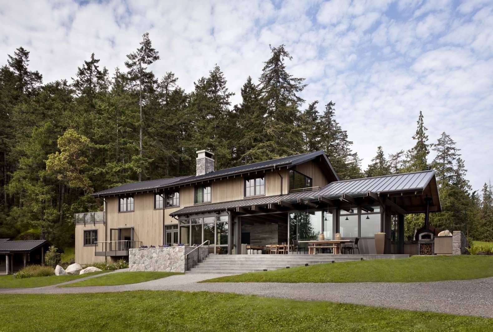 Located on Orcas Island, the largest of the San Juan Islands in Washington, the year-round retreat includes a new main house and six renovated cabins loosely arranged around a semi-circular lawn facing the beach.