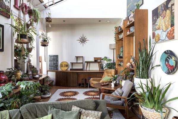 John's passions for midcentury furniture and gardening dominate the space, a project which started seven years before Ricky moved in. Ricky relinquished his preference for sleek modernism in return for the sprinkling of Madonna-themed decor.