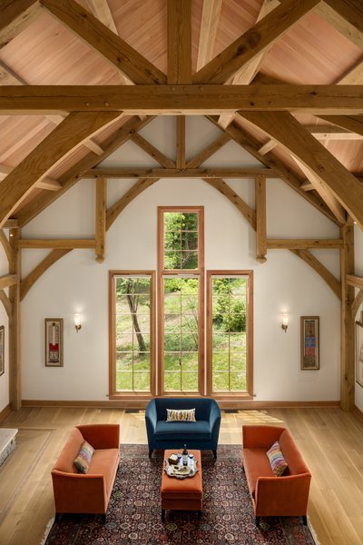This view from the loft of this renovated barn by OakBridge Timber Framing highlights the elegant combination of old and new elements.