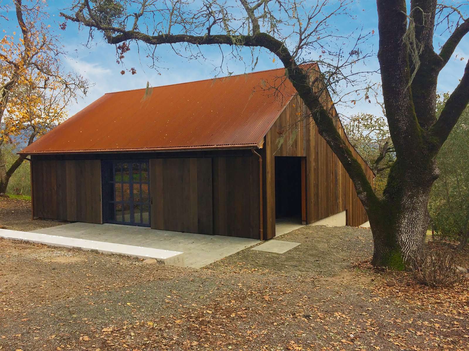 The barn’s original framing was kept for its agricultural character. Faulkner Architects applied an exterior envelope of salvaged redwood and added a Cor-Ten steel roof that will patina over time.