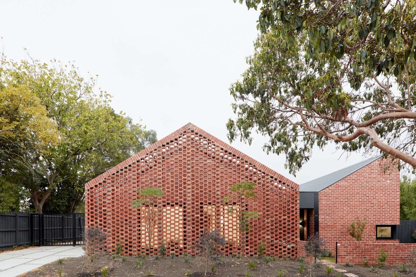 Located behind two Californian bungalows, Bardolph Gardens sits on a long-underutilized, subdivided lot. The most challenging aspect of the project was hooking the homes up to new service connections.