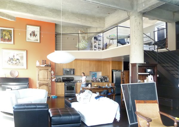 Before: The loft’s interior felt disjointed and the kitchen crowded the entry.