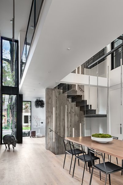 Oiled, wide-plank, white oak flooring from Stone Tile runs through the first floor.