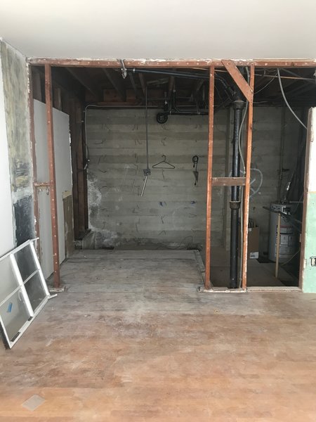 Before: "We basically just blew the walls open to expose the cement board form walls and use that as the backsplash," says Jonathan Taylor.