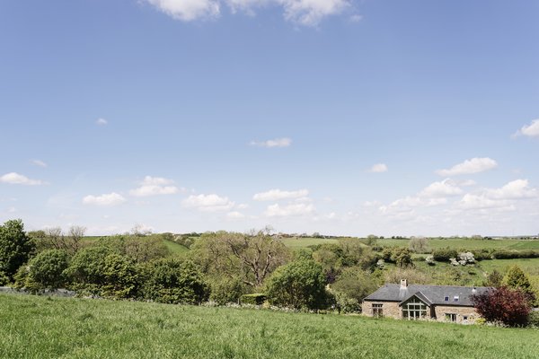 Just a few hours outside of London, the English village of Toller Porcorum swaps city streets for rolling hills and grassland. The Scythe Barn is a converted residence offering views of Marshwood Vale and out toward Lyme Bay.