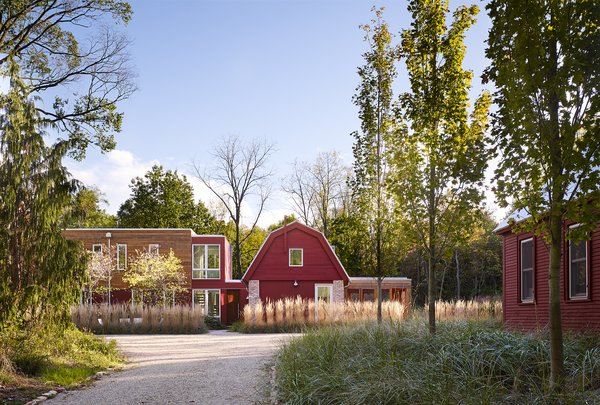 Vibrant red siding references the original buildings on the site.