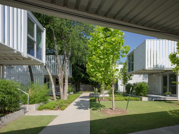 A central "street" runs through the development and affords the feeling of a micro-neighborhood with the recessed front entrances of each home connecting to the communal path.