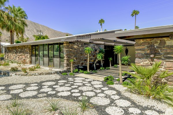 Originally built in 1957, this Twin Palms home was designed by William Krisel. Recently, the home was renovated with an updated kitchen and bathrooms that remain true to the residence’s midcentury character.