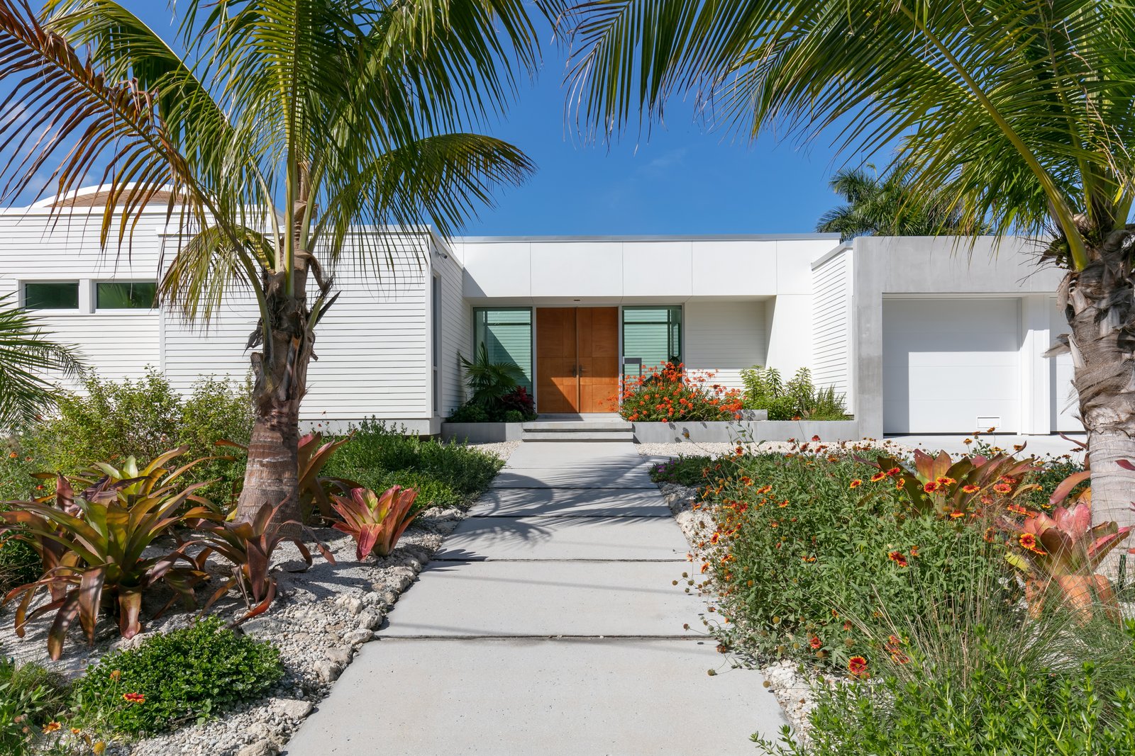 A path through the front yard's native plantings leads visitors to the front door. 