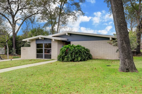 Nestled on a lush lot with mature trees sits 5443 Whispering Creek Way, a charming one-level midcentury that was recently treated to a top-down renovation.