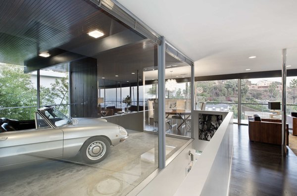 Architect Leo Marmol reinstated one of Neutra's original features by reinstalling floor-to-ceiling glass around one corner of the carport. The L.A. Times article noted that previous owners had covered the windows with chipboard to block views from the street; Marmol opted for a new half-wall and shades to help make the space more livable for its owners.