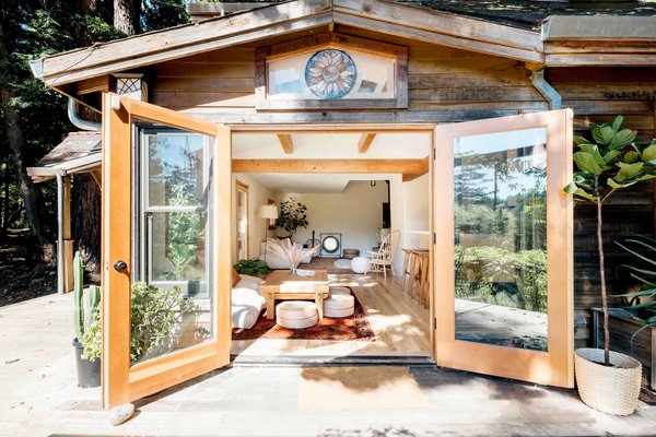 In designing the space, Eva and Jamie were all about bringing the outdoors in—hence they incorporated lots of wood and reclaimed materials. The living room sofa and chair are from Article.