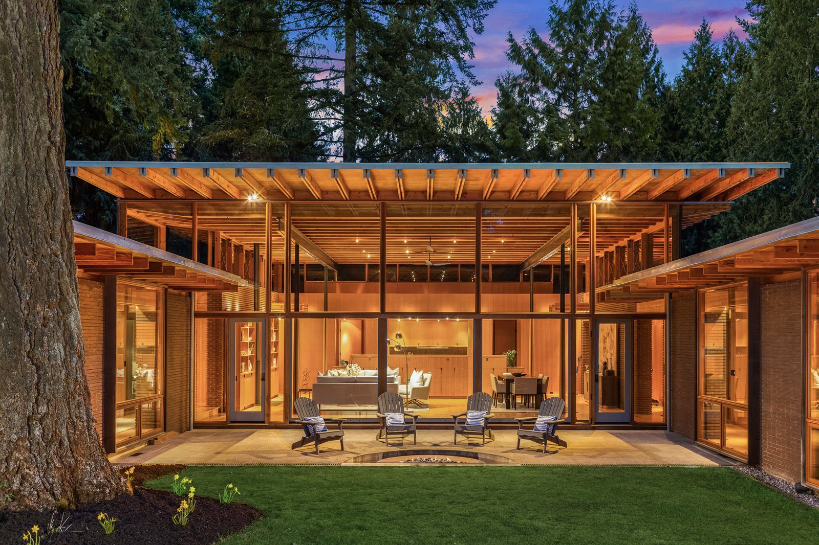 A patio connects the two private wings and the central public area. About the firm's philosophy as embodied by this project, Cutler adds: "Nature takes on a will and spirit of its own in every project. We work to release that spirit."