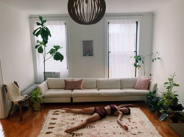 Jules Bakshi allows her body to take up space, have fun, and enjoy movement amongst the house plants.