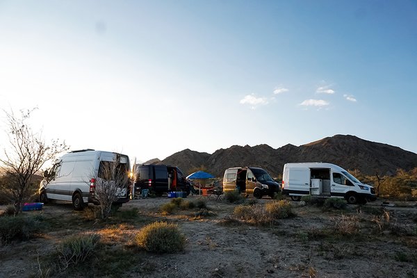 Katie Larsen runs a van lifestyle website from the road. She was bouncing around Lake Tahoe with her boyfriend when he lost his service industry job and shelter in place began. The two made plans to head to a remote part of the California-Nevada desert to batten the hatches with three other vans. The nearest town is 30 minutes away, and they take turns shopping for the group to avoid too many outings. Free water is just a mile-and-a-half drive away. The group agreed to stop talking about shelter in place for sanity’s sake. 