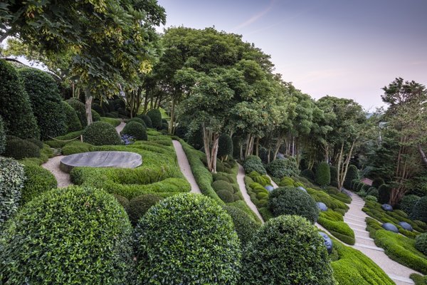 Zigzagging pathways take visitors down the steep slopes of Les Jardins d'Étretat.