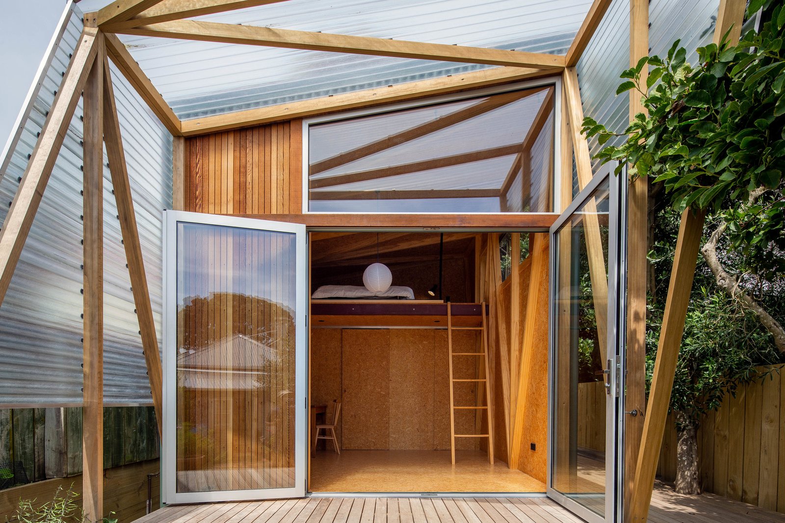 A Wellington, New Zealand, couple loved their neighborhood of Berhampore, but found that with two young sons, they were running out of space. They called on Parsonson Architects to devise a solution, which came in the form of a 183-square-foot studio in the backyard of their two-bedroom Victorian cottage. 