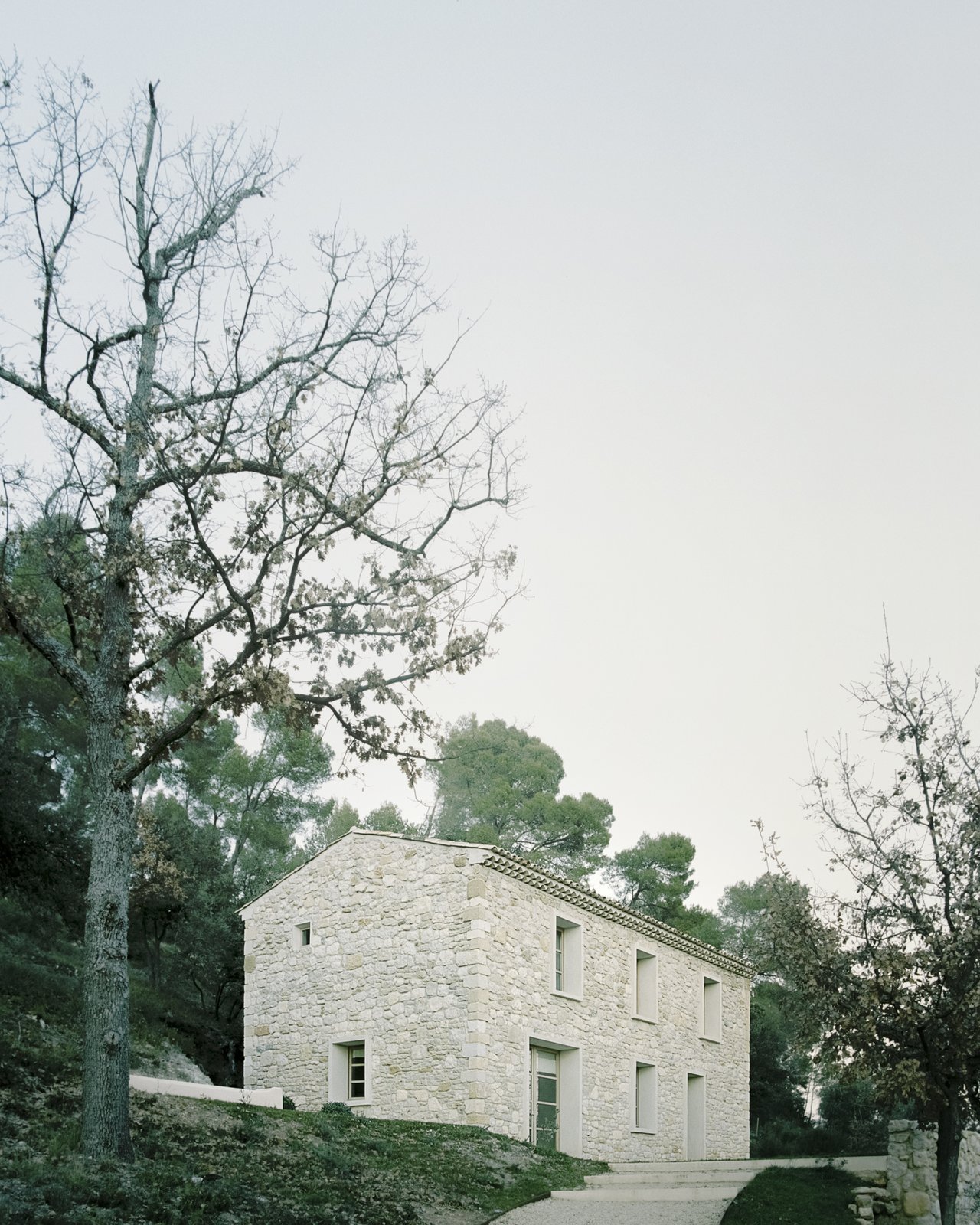 Architect Timothee Mercier of Studio XM converted a crumbling farmhouse into a residence for his parents.