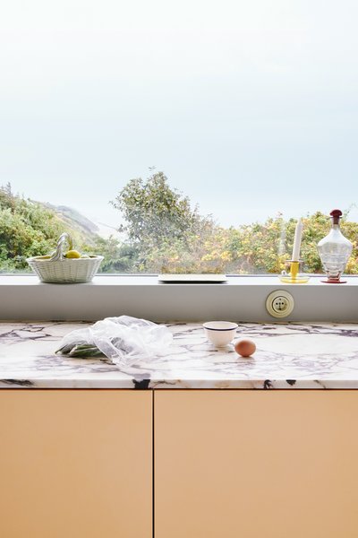 A Calacatta Viola marble countertop is the standard offering with the MATCH kitchen—both an unexpected contrast material and an integral part of Muller Van Severen’s edgy design. 