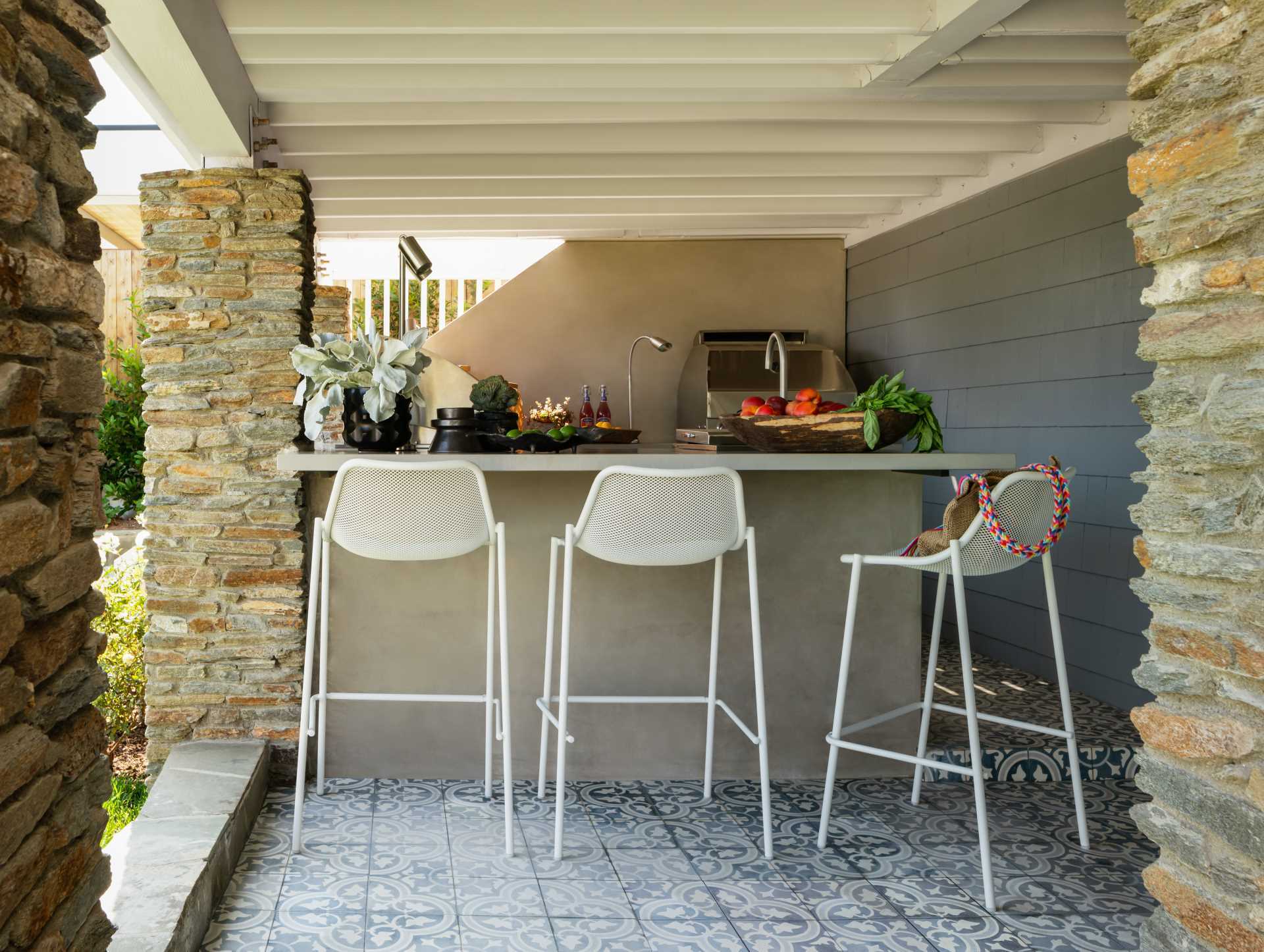An outdoor kitchen was added underneath an existing deck.