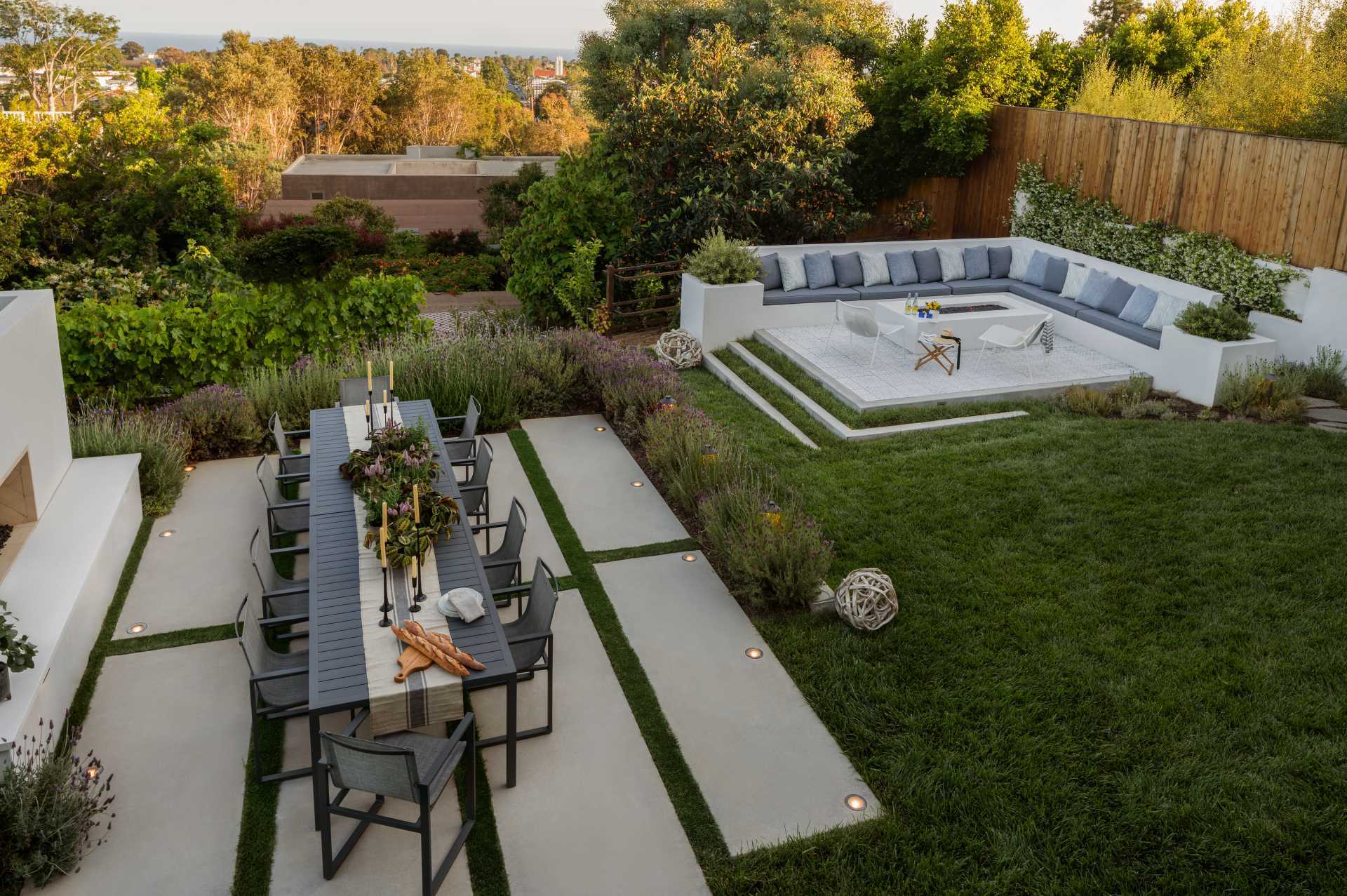 A modern landscaped yard with seating area, alfresco dining, and kitchen garden.