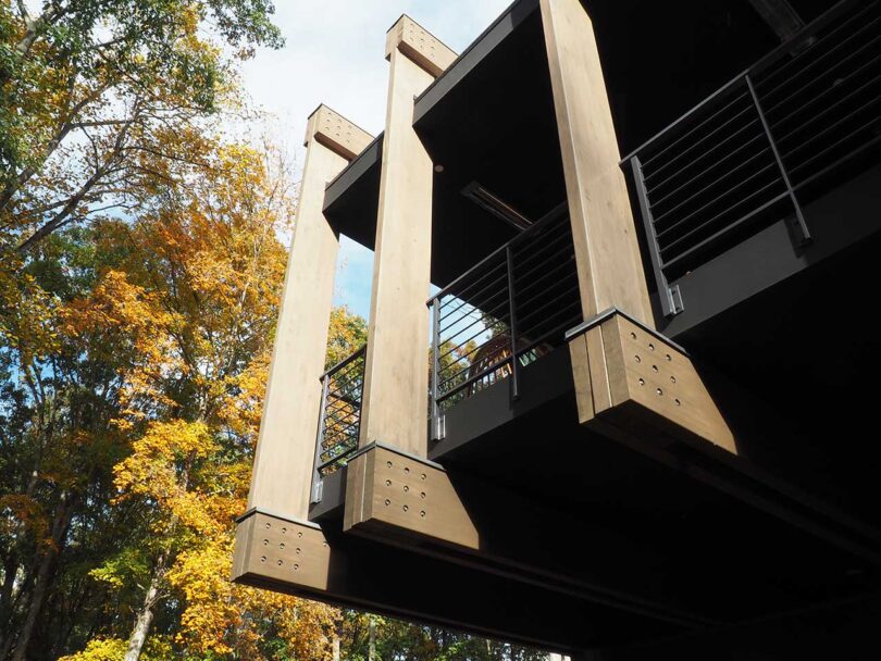 angled up view of corner of modern house with pillars