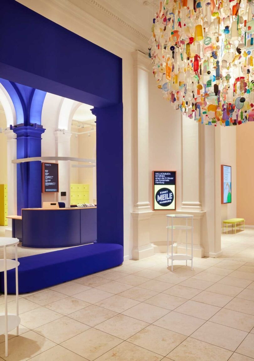 angled foyer view in modern museum with blue kiosk