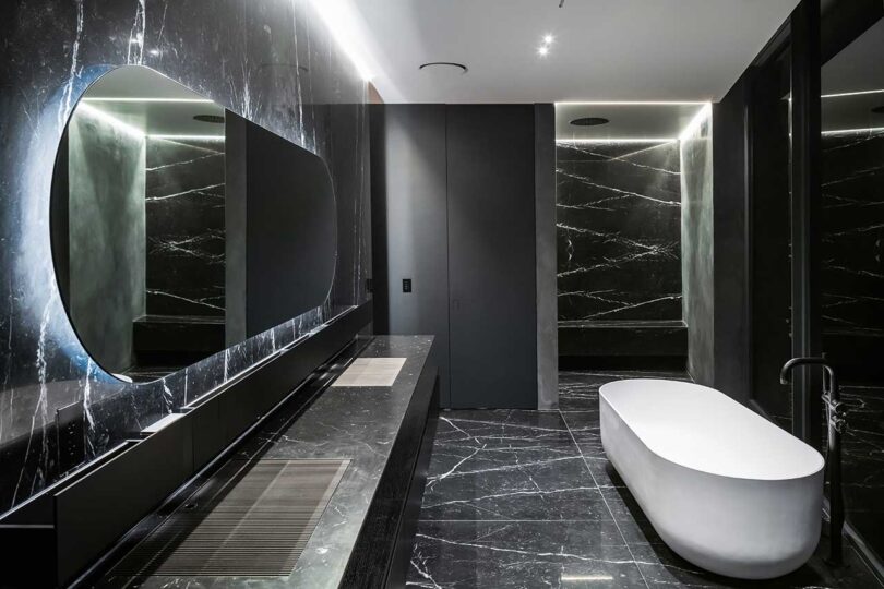 modern bathroom interior with black and white grained marble