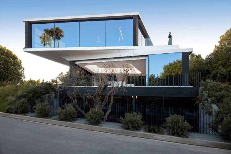 exterior view of two floor futuristic house with cantilevered floor sticking out