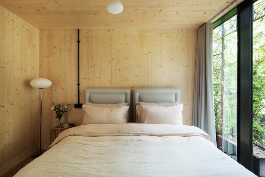 Wooden bedroom of Woven house by Giles Miller Studio