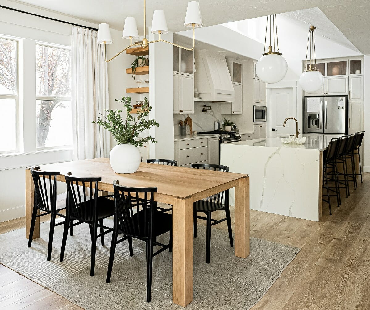 Modern farmhouse dining table style with black shaker-style dining chairs