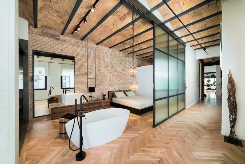 view looking out to interior patio of modern house with plants