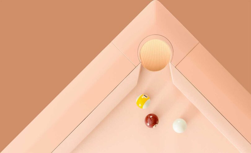 down corner view of a modern pale pink pool table
