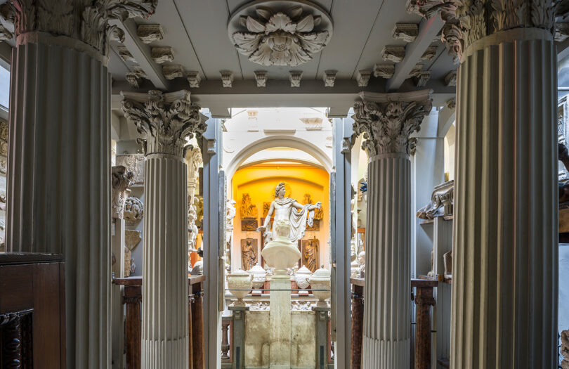 museum wing with columns and statues