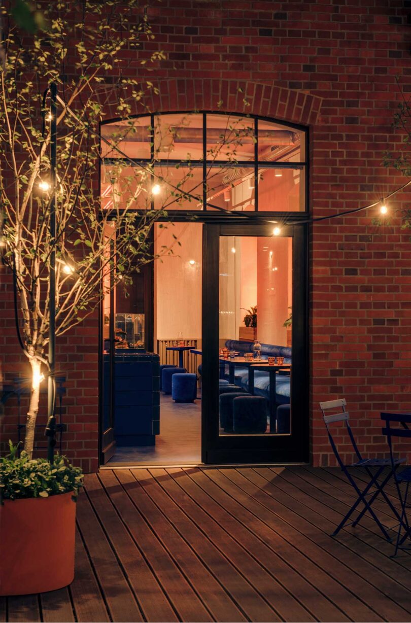 evening view from patio looking into cafe's open door