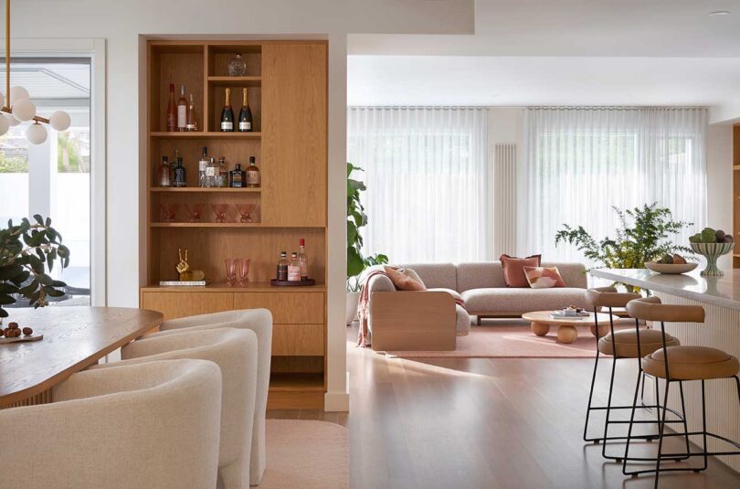 partial interior view of modern living room with tonal furnishings in pink shades