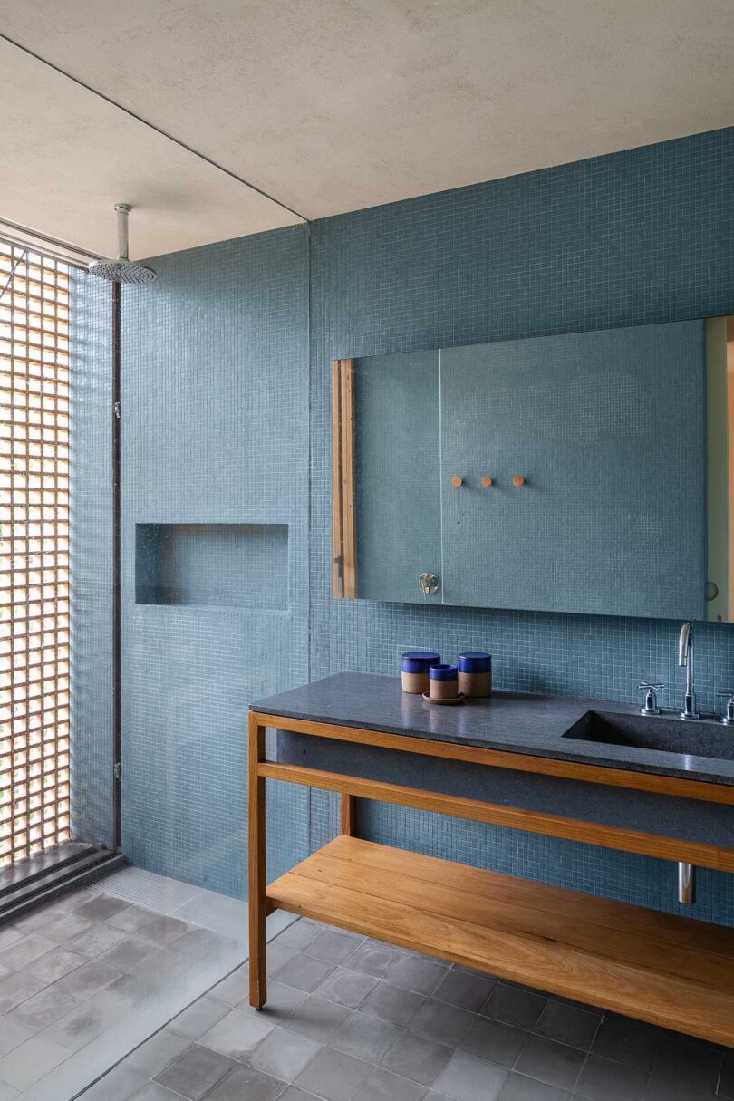angled view of modern bathroom with blue wall