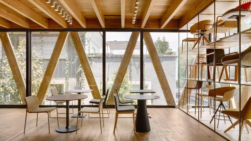 Interior space with wooden trusses and exposed wooden beams