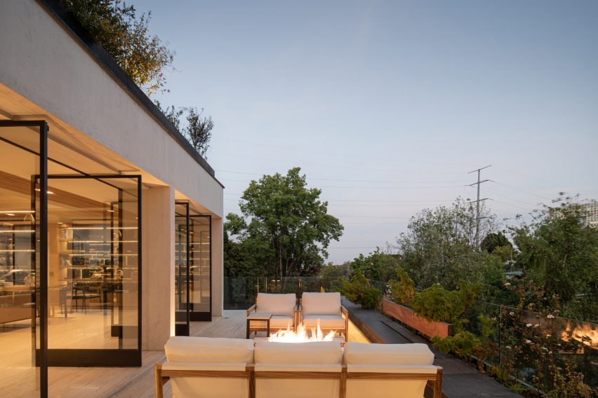 Outdoor terrace with a fire pit at Casa Madre by Taller David Dana