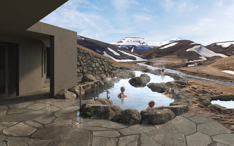 Four bathers enjoying the geothermally heated hot spring pools outside of the Highland Base - Kerlingarfjöll with a a snowy mountain landscape visible in the distance.