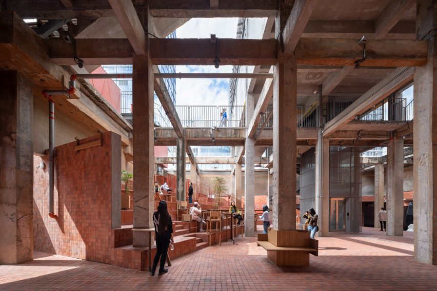 Auditorium framed by exposed concrete structure